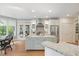 Bright kitchen features granite island and stainless steel appliances at 3928 White Chapel Way, Raleigh, NC 27615