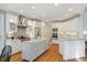 Spacious kitchen features granite island and stainless steel appliances at 3928 White Chapel Way, Raleigh, NC 27615
