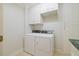 Efficient laundry room showcasing a washer, dryer, ample cabinet space, and practical design at 3928 White Chapel Way, Raleigh, NC 27615