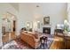 Bright living room with fireplace, large windows, and elegant decor at 3928 White Chapel Way, Raleigh, NC 27615
