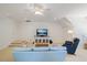 Bright living space featuring a large television, cozy furniture, and versatile layout for relaxation and entertainment at 3928 White Chapel Way, Raleigh, NC 27615
