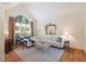 Bright living room features vaulted ceilings and hardwood floors at 3928 White Chapel Way, Raleigh, NC 27615