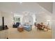 Expansive living area with ample seating, natural light, a ceiling fan, and versatile layout at 3928 White Chapel Way, Raleigh, NC 27615