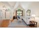 Vaulted living room is bright and has an oversized window at 3928 White Chapel Way, Raleigh, NC 27615