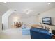 Versatile living area featuring a large television, comfortable seating, and ample space for various activities at 3928 White Chapel Way, Raleigh, NC 27615