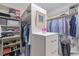 Well-organized walk-in closet featuring ample storage and built-in shelving at 3928 White Chapel Way, Raleigh, NC 27615