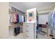 Organized walk-in closet with built-in shelving, drawers, and hanging rods at 3928 White Chapel Way, Raleigh, NC 27615