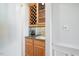 Wet bar features granite countertop and custom cabinetry at 3928 White Chapel Way, Raleigh, NC 27615