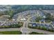 Aerial view of community with a central pool, surrounded by residential housing and greenery at 408 Torwood Cir, Apex, NC 27523