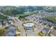 Community aerial view featuring a pool, playground, and well-maintained landscaping at 408 Torwood Cir, Apex, NC 27523