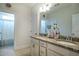 Bathroom featuring dual sinks with granite countertops and white cabinets at 408 Torwood Cir, Apex, NC 27523