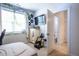 View of a bedroom leading into the bathroom with white trimmings and ivy decor at 408 Torwood Cir, Apex, NC 27523