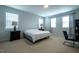 Bright bedroom with three windows, neutral carpet, and simple decor for a comfortable, restful space at 408 Torwood Cir, Apex, NC 27523