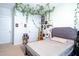 A cozy bedroom featuring charming ivy decor, neutral tones and a white door at 408 Torwood Cir, Apex, NC 27523