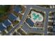 Aerial view showcasing a community pool, playground, and surrounding neighborhood layout at 408 Torwood Cir, Apex, NC 27523