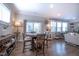 Cozy dining area with a wooden table, elegant lighting, and seamless flow to the living space at 408 Torwood Cir, Apex, NC 27523