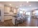 Modern kitchen with stainless steel appliances, a large island, and elegant pendant lighting at 408 Torwood Cir, Apex, NC 27523