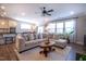 Bright and airy living space with a comfortable sectional, a kitchen view, and abundant natural light at 408 Torwood Cir, Apex, NC 27523