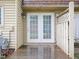 Back patio with double doors, wood deck, and a privacy fence at 4816 Blue Bird Ct # B, Raleigh, NC 27606