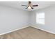 Bedroom featuring neutral carpet, ceiling fan, and a window for natural light at 4816 Blue Bird Ct # B, Raleigh, NC 27606