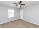 Neutral bedroom with a ceiling fan and a window at 4816 Blue Bird Ct # B, Raleigh, NC 27606