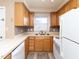 Functional kitchen featuring updated cabinets, new stainless appliances, and a mosaic backsplash at 4816 Blue Bird Ct # B, Raleigh, NC 27606