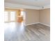 Open-concept living space with french doors, hardwood floors, and eat-in kitchen with modern appliances at 4816 Blue Bird Ct # B, Raleigh, NC 27606