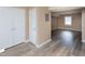Open-concept living room with modern wood floors and ample closet space at 4816 Blue Bird Ct # B, Raleigh, NC 27606