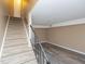 Stairway leading into living room with modern wood floors at 4816 Blue Bird Ct # B, Raleigh, NC 27606