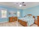 Airy bedroom featuring beach-themed decor, hardwood floors, and natural light at 490 Shawnee Dr, Louisburg, NC 27549
