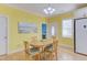 Cozy dining room with hardwood floors and natural light, adjacent to the kitchen at 490 Shawnee Dr, Louisburg, NC 27549
