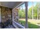 Comfortable covered front porch with a seating area offering a pleasant outdoor space at 490 Shawnee Dr, Louisburg, NC 27549