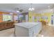 Bright kitchen with island and granite countertops overlooks the living and dining areas at 490 Shawnee Dr, Louisburg, NC 27549