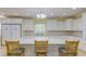 Spacious eat-in kitchen with island, granite countertops, double door refrigerator, and stainless steel appliances at 490 Shawnee Dr, Louisburg, NC 27549
