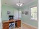 Office featuring natural light from two windows, neutral walls, and hardwood floors at 490 Shawnee Dr, Louisburg, NC 27549