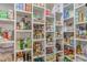 Walk-in pantry with white shelves stocked with a variety of food items at 490 Shawnee Dr, Louisburg, NC 27549