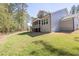 Spacious backyard featuring a screened-in porch, perfect for outdoor relaxation and entertaining at 50 Gadwall Ct, Zebulon, NC 27597