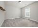 Bright bedroom with neutral walls, carpeted floors, a window, and a single floating shelf at 50 Gadwall Ct, Zebulon, NC 27597