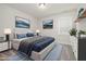 Comfortable bedroom featuring a large bed, a blue accent rug, and plenty of natural light from a nearby window at 50 Gadwall Ct, Zebulon, NC 27597