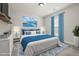 Beautifully staged bedroom features stylish decor, plush bedding, and soothing color accents at 50 Gadwall Ct, Zebulon, NC 27597