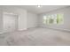 Expansive bonus room with neutral carpet, ample natural light, and recessed lighting at 50 Gadwall Ct, Zebulon, NC 27597
