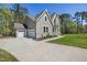 Stately home with a three-car garage, manicured lawn, and welcoming front entrance at 50 Gadwall Ct, Zebulon, NC 27597