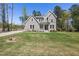 Inviting home showcases a lush front lawn and charming architectural details at 50 Gadwall Ct, Zebulon, NC 27597