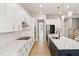 Modern kitchen featuring white cabinets, granite countertops, and stainless steel appliances at 50 Gadwall Ct, Zebulon, NC 27597