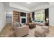 Inviting living room with a fireplace, built-in bookshelves, and comfortable seating arrangement at 50 Gadwall Ct, Zebulon, NC 27597