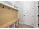 Functional mudroom with built-in bench, hooks, and storage at 50 Gadwall Ct, Zebulon, NC 27597