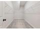 Spacious walk-in closet featuring gray carpet and white wire shelving on all sides to maximize organization at 50 Gadwall Ct, Zebulon, NC 27597