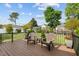 Back deck with patio furniture, black metal railing, and a lush green lawn at 503 Fish Pond Ct, Rolesville, NC 27571