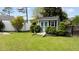 Charming shed features a quaint design, enhancing the appeal of the landscaped backyard at 503 Fish Pond Ct, Rolesville, NC 27571