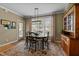 Eat-in dining area with rug, wood table, upholstered chairs, and natural light at 503 Fish Pond Ct, Rolesville, NC 27571